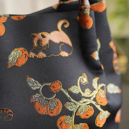 Songjin silk persimmon cat bamboo handbag